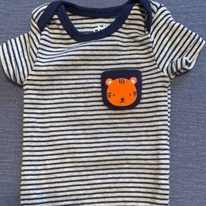 Assorted newborn onesies